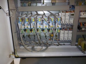 Photo of cabinet with upgraded servo drives, reusing existing motors, command cables, encoders ans control system.